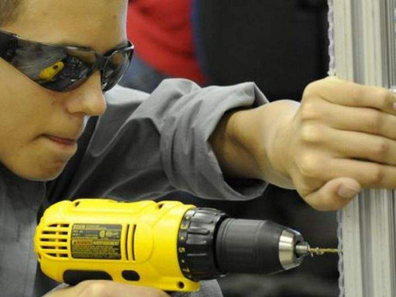 man with a cordless rotary hammer